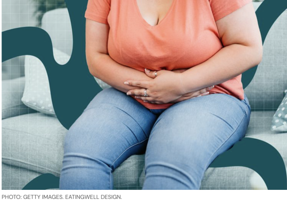 Woman sitting with GI discomfort from her GLP-1 medication