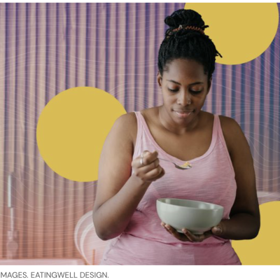 Woman in pink top eating dairy from bowl