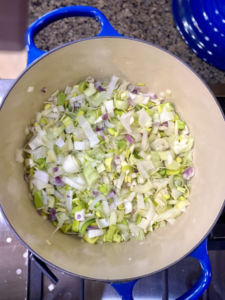 Pan with diced leek and onions cooking