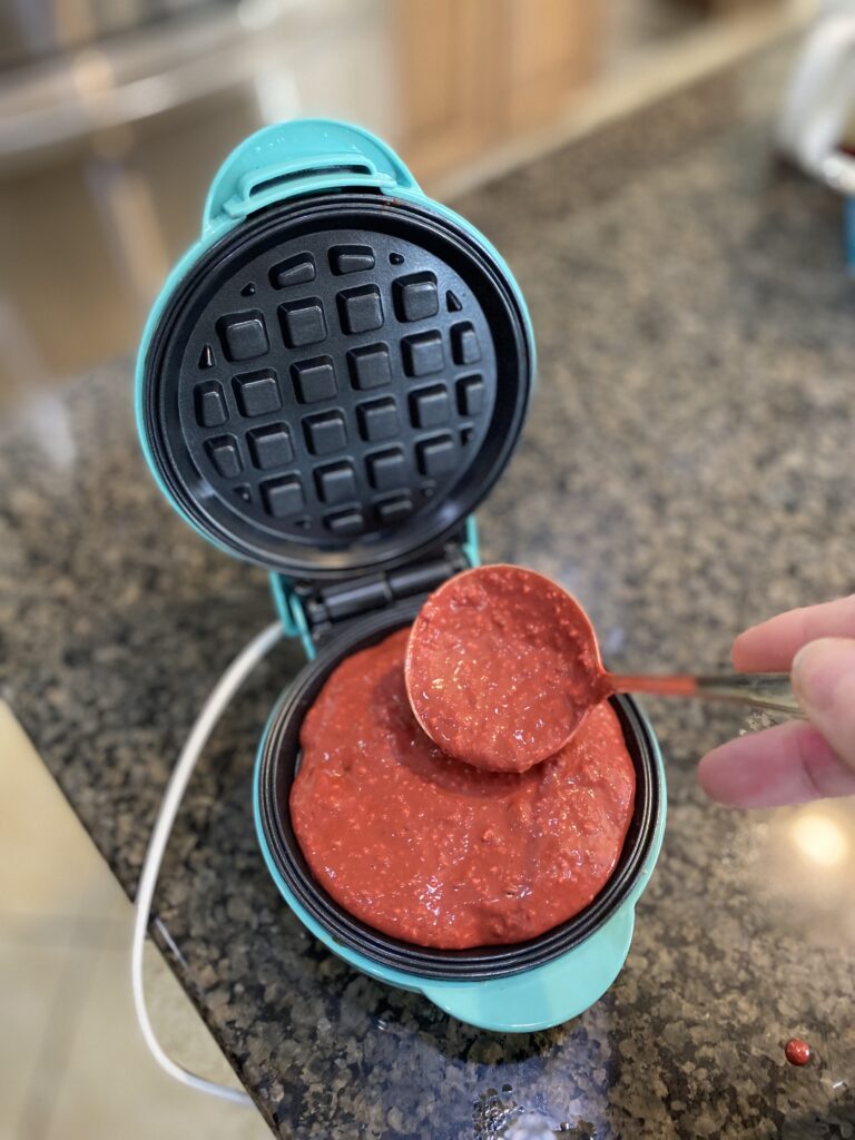 red velvet waffle batter in single serve waffle iron