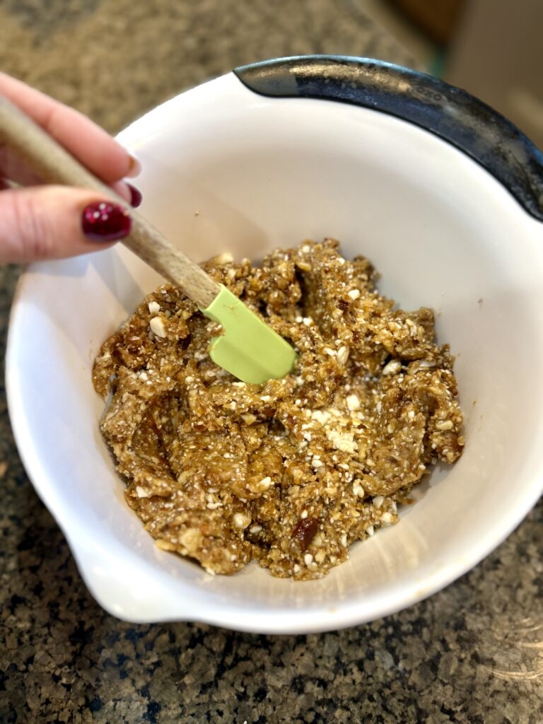 Mixed ingredients in bowl with spatula